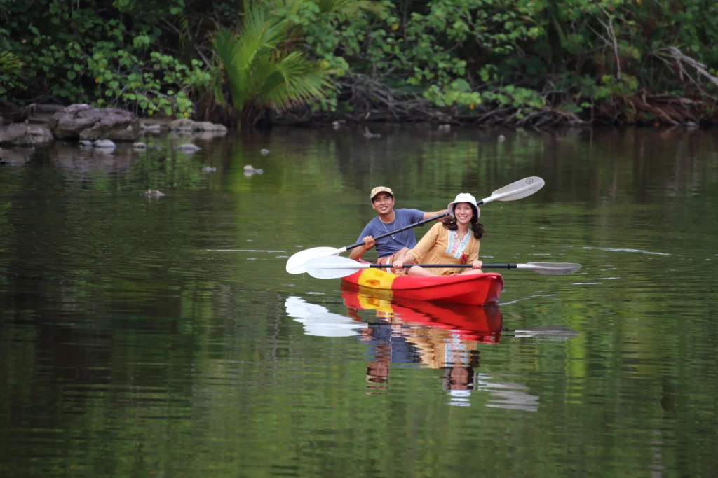 Couple kayaking through a peaceful waterway on Sanibel Island